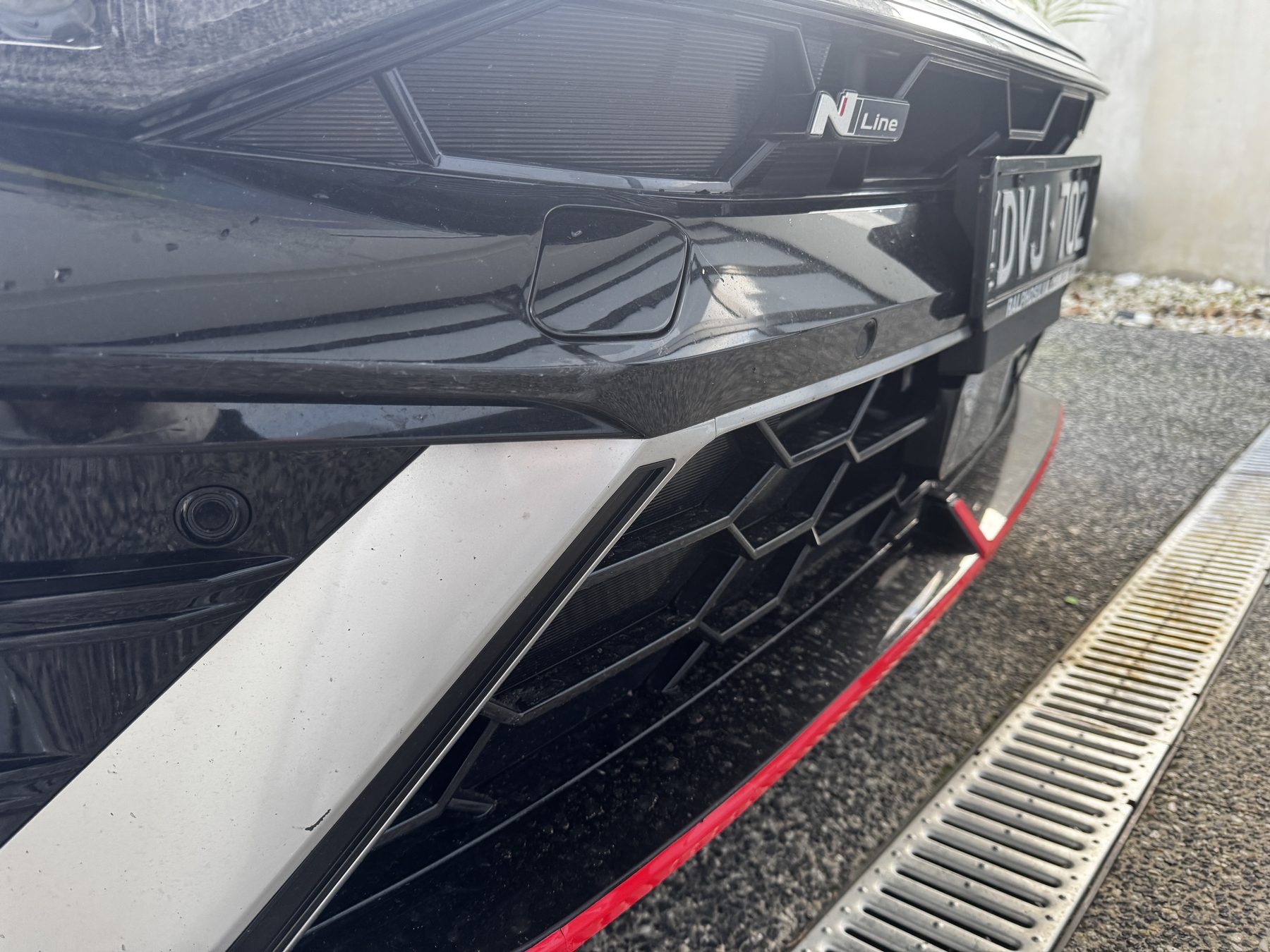 Front bumper & grille detail — before